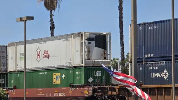Containers passing through onboard a rail train.
