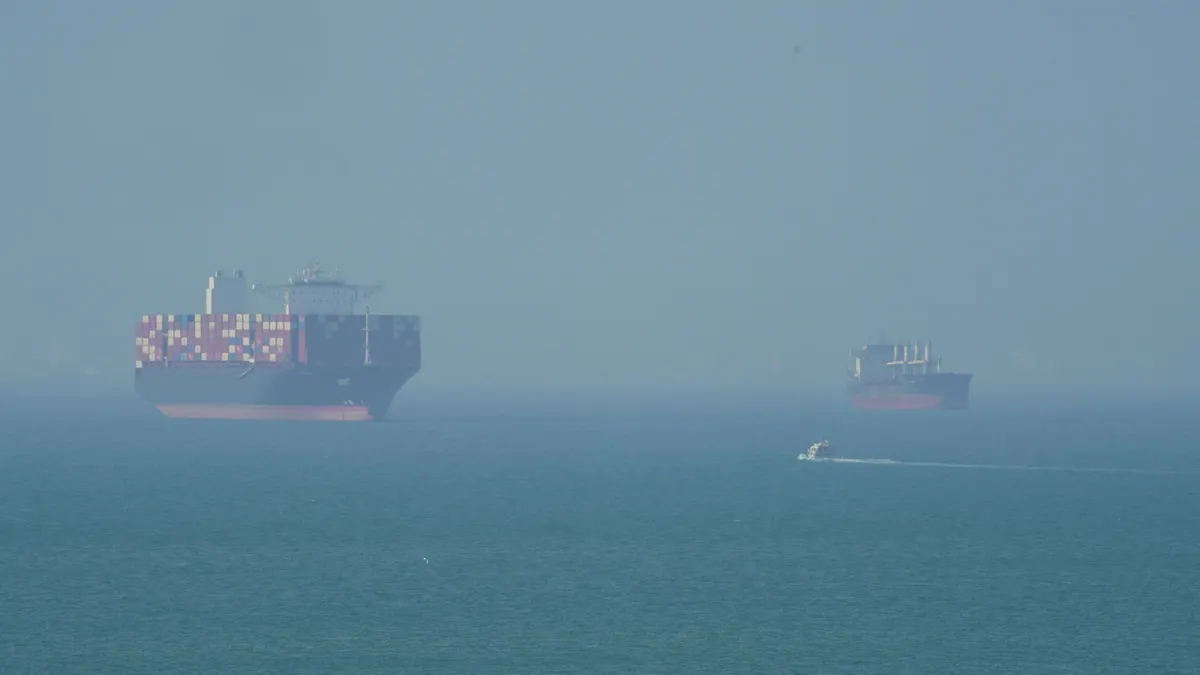 A wide shot of massive ships on the ocean.