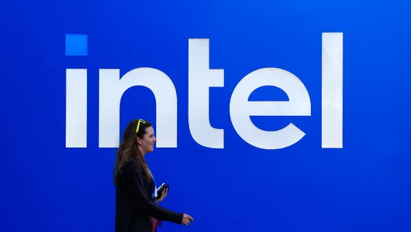 The Intel logo is displayed on a sign in front of the company headquarters on July 16, 2025 in Santa Clara, California.