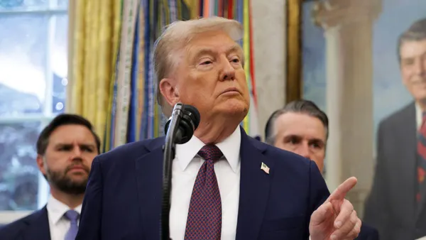 U.S. President Donald Trump takes questions from reporters in the Oval Office at the White House.