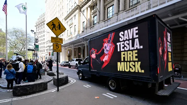 A truck reading "Save Tesla. Fire Musk." outside of NYC on Ap. 22, 2025