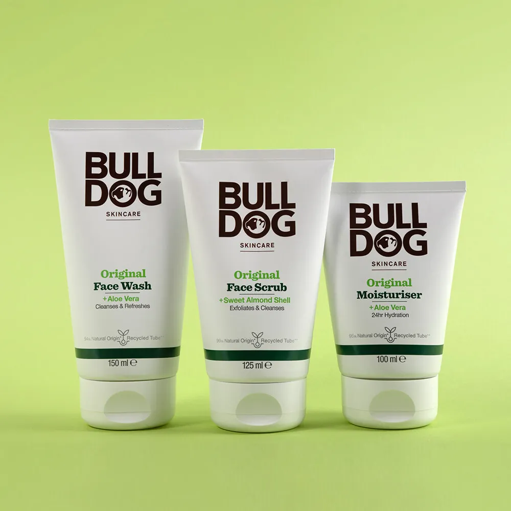 Three squeeze tubes with branding on them for Bulldog skincare.