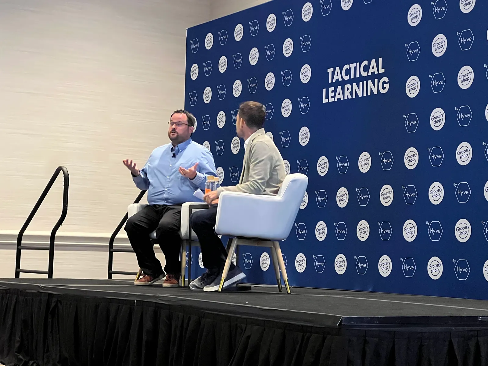 Schnucks technology executive Caleb Carr speaking at Groceryshop