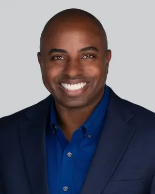 Headshot of a man in a suit.