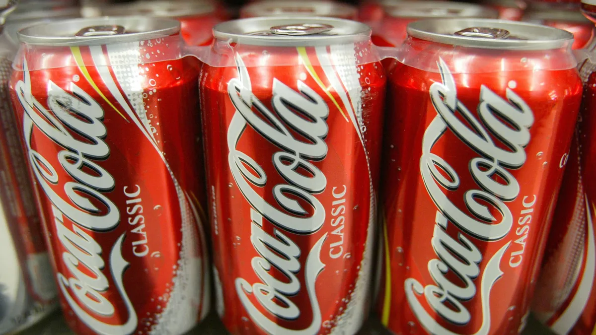 Row of Coca-cola metal cans