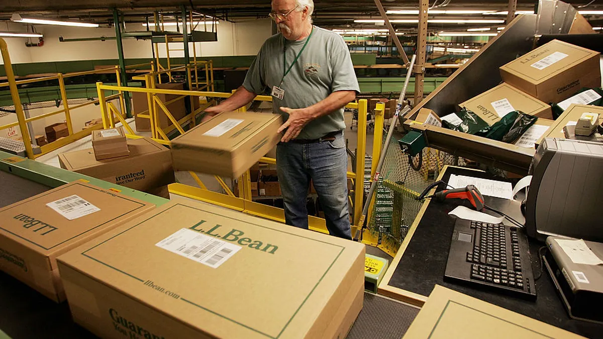 A worker sorts boxed orders in the L.L. Bean shipping center on Nov. 28, 2005 in Freeport, Maine.