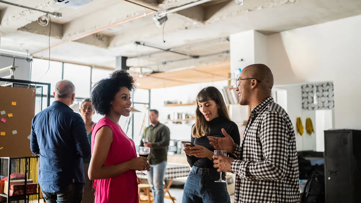 Colleagues talking after work at a coworking