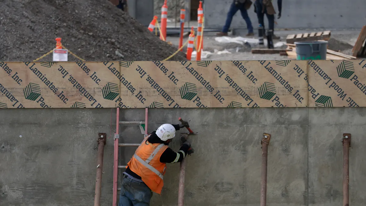 Construction workers build out a new building in San Francisco, California