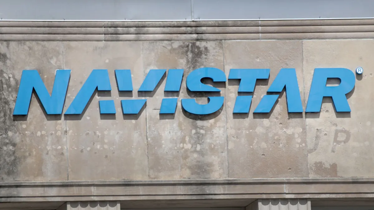 The Navistar company logo hangs above the company's corporate headquarters on April 17, 2018 in Lisle, Illinois.