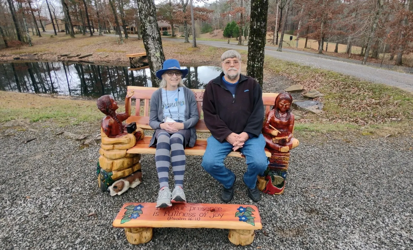 Marianne and Jerry Karth sit on the memorial bench.