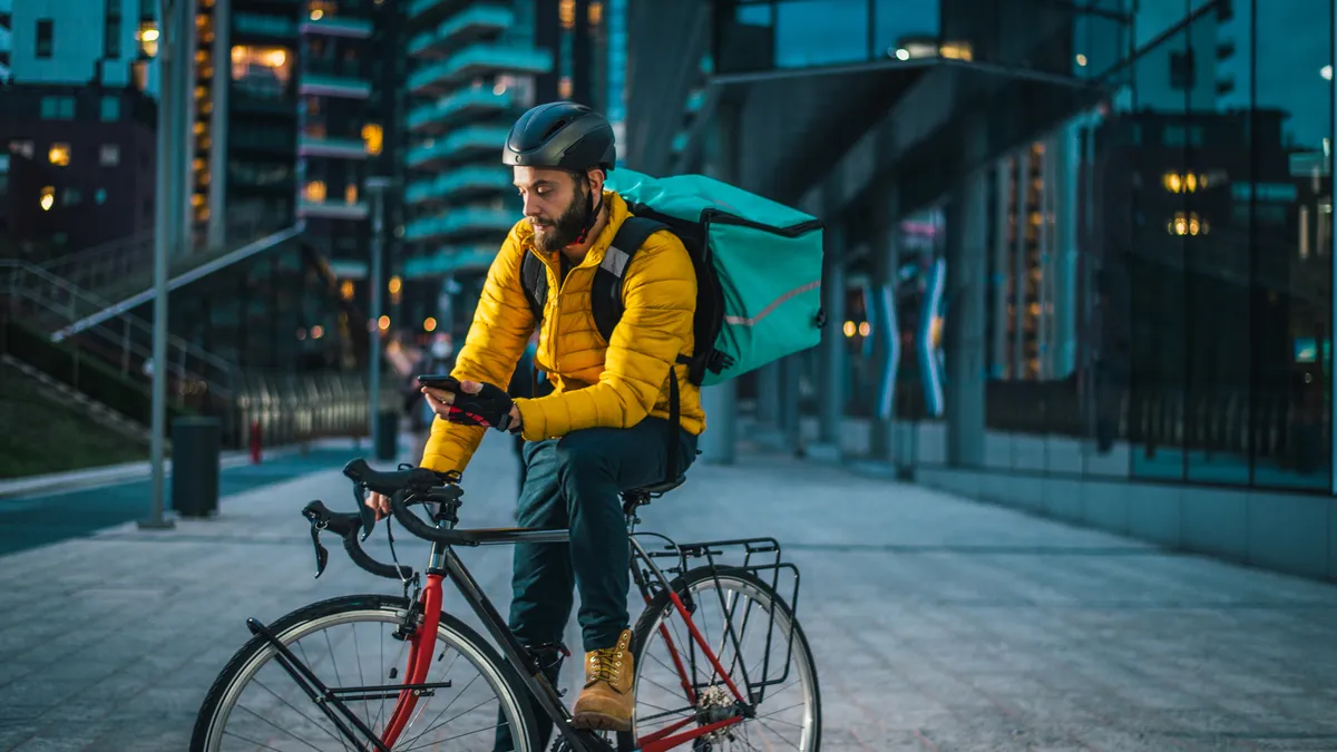 Food delivery, rider with bicycle delivering food