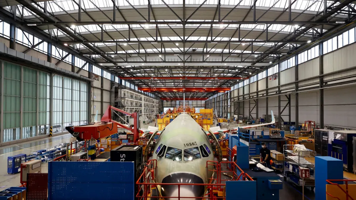 A plane within the A320 passenger aircraft family is pictured at the assembly line at the Airbus factory on Jan. 18, 2022, in Hamburg, Germany.