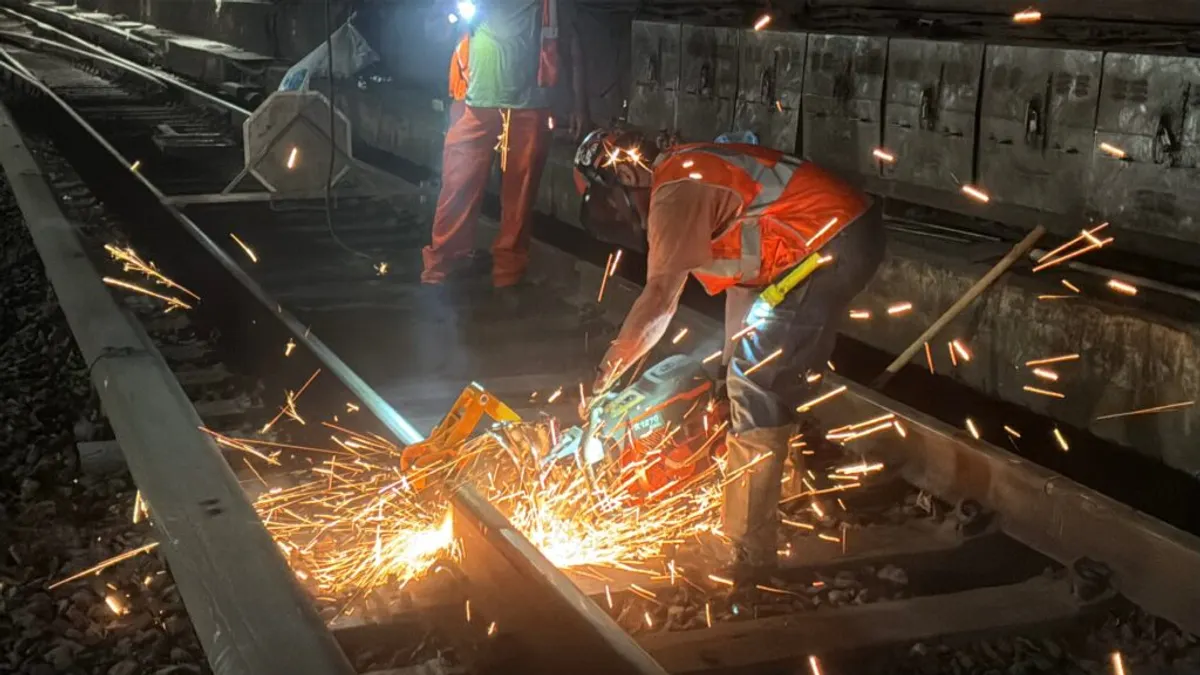 Crews cut rail into smaller segments