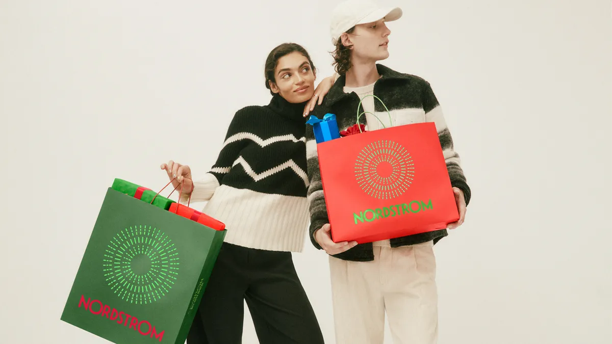 Two people with shopping bags.