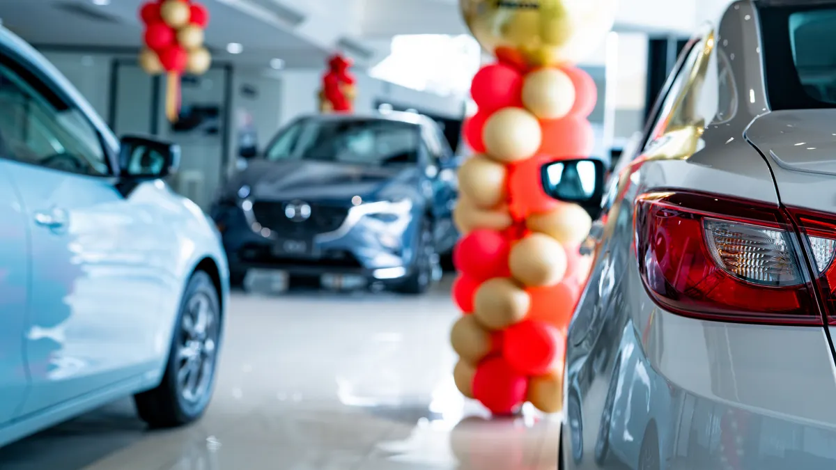 A new car parked in modern showroom.