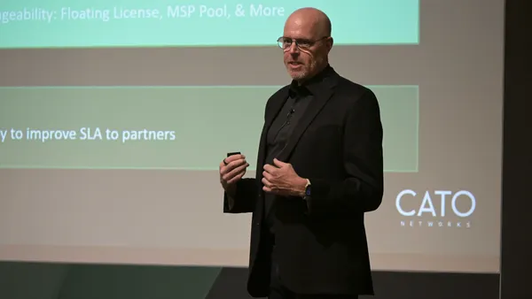 a man presenting in front of a screen