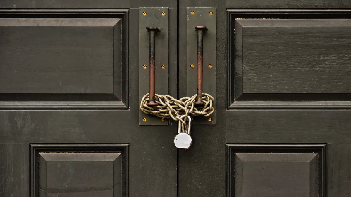 padlocked wooden door