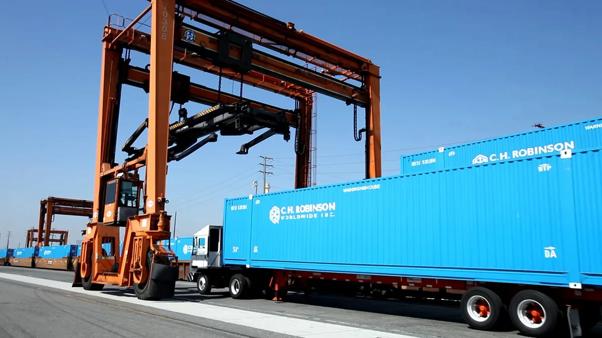 a blue container at an ocean port.