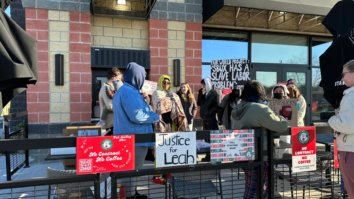 A photo of Starbucks workers participating in a strike in Nottingham, Maryland, Nov. 17, 2022