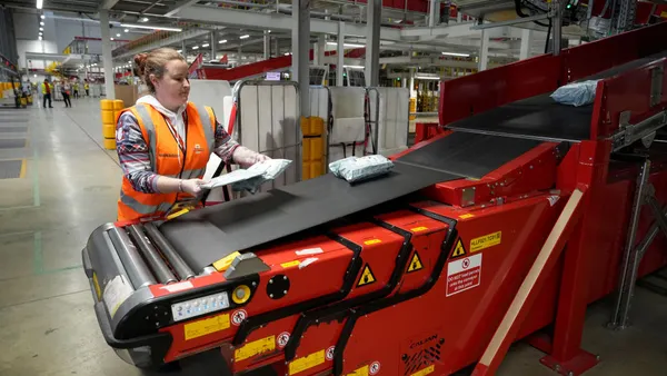 Packages pass though the Royal Mail Midlands 'Super Hub' on Dec. 16, 2024 in Daventry, England.
