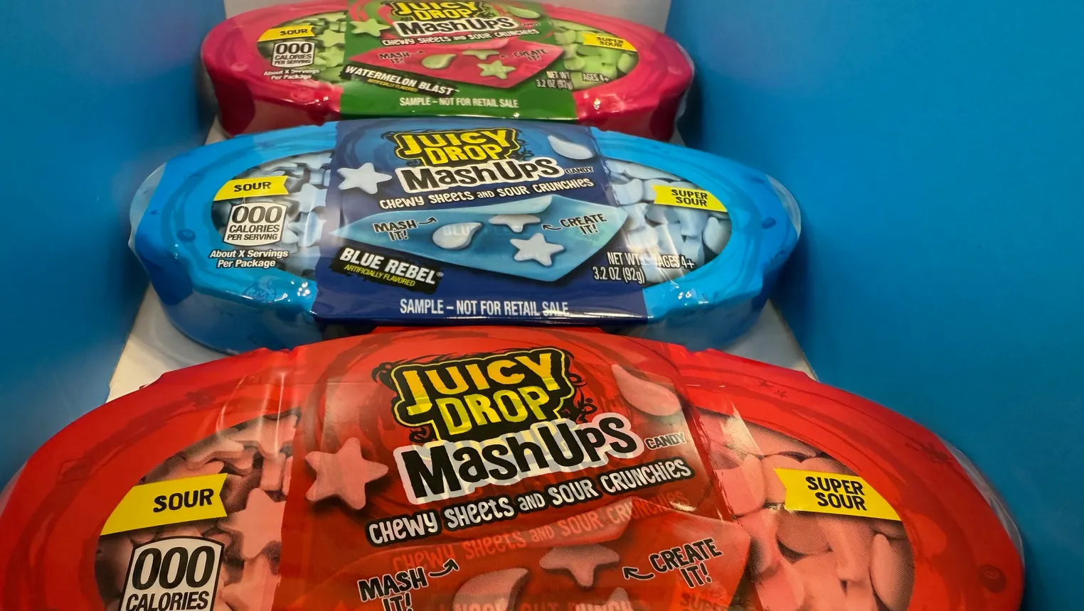 Containers of Juicy Drop MashUps made by Bazooka Brands