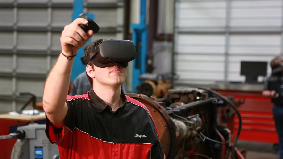 A Wallace State Community College Diesel Technology student using virtual reality equipment.