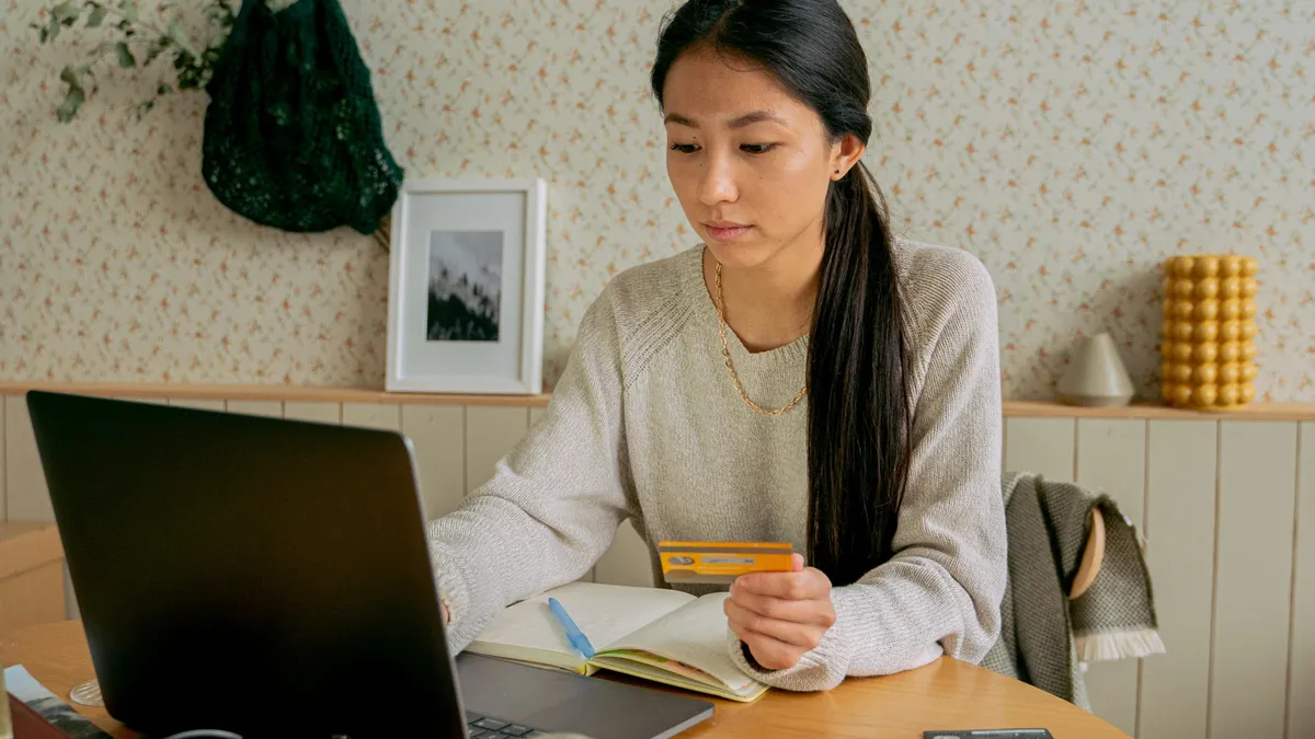 person holding credit card