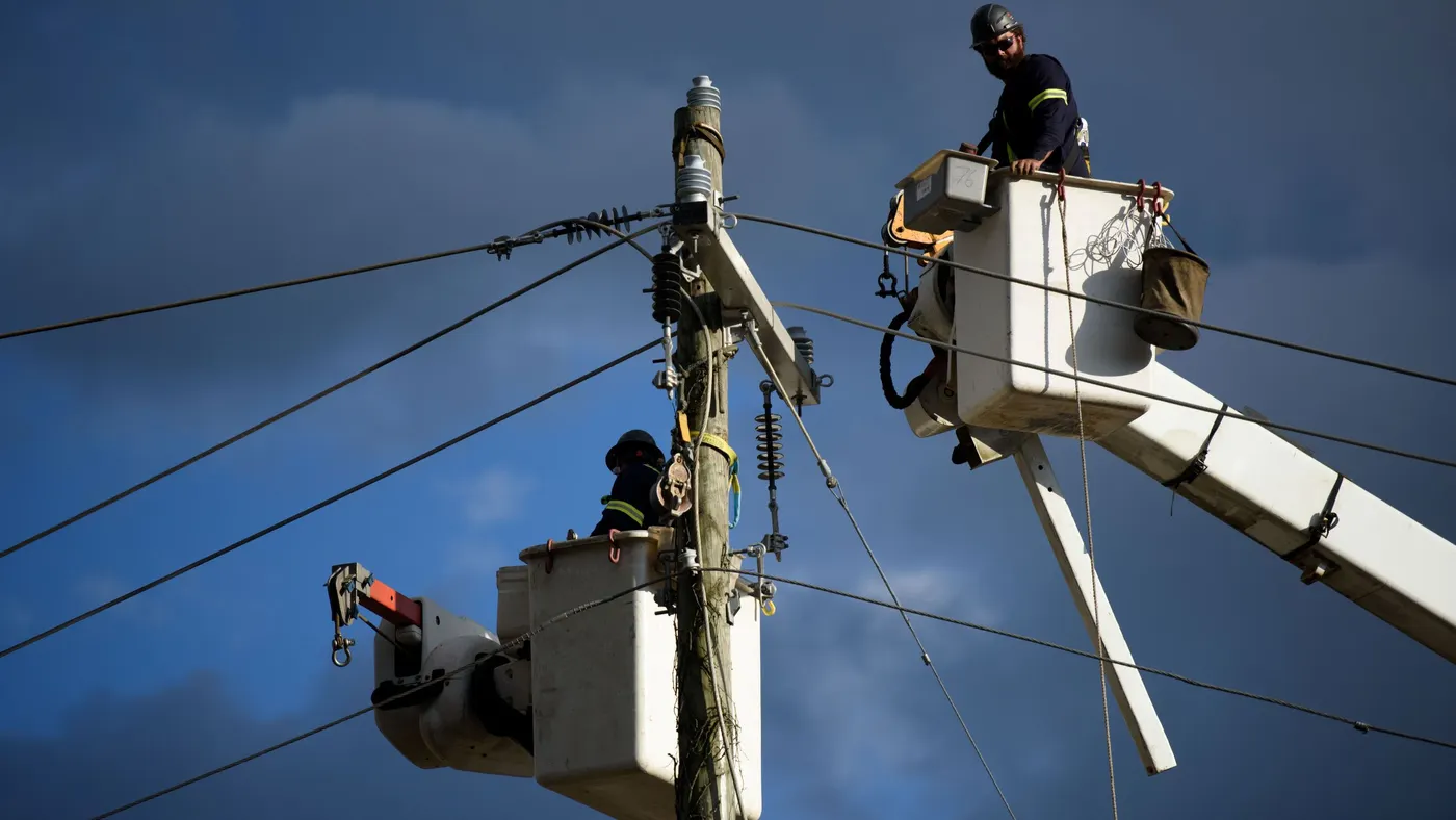 Linemen work to restore power.