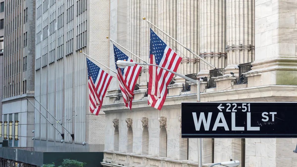 American flags in front of marble building