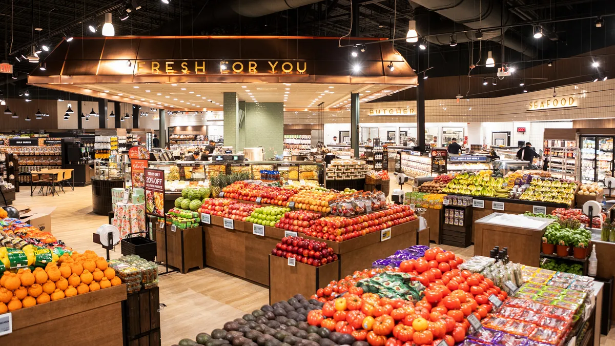 View of The Fresh Market's center store area, including produce area and Fresh For You department