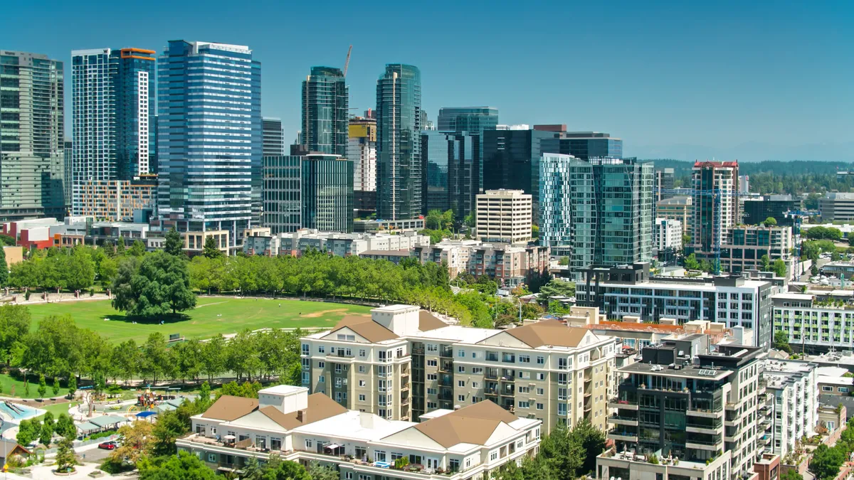 An aerial shot of modern office towers and Downtown Park in Bellevue, Washington on a sunny summer day.