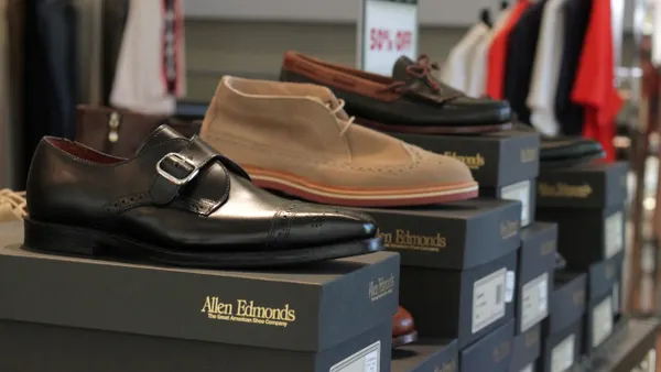 Allen Edmonds shoes are displayed in a store.