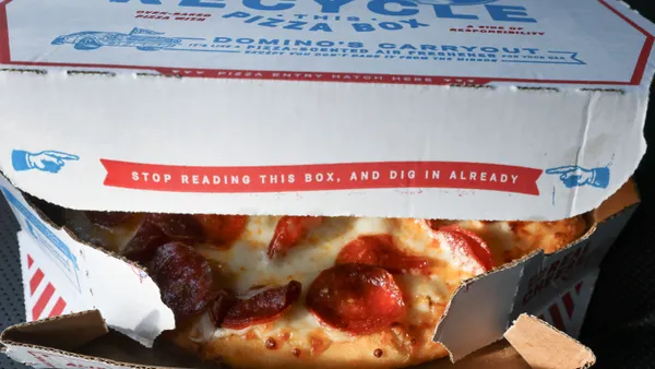 Open box with pepperoni pizza showing through small opening.