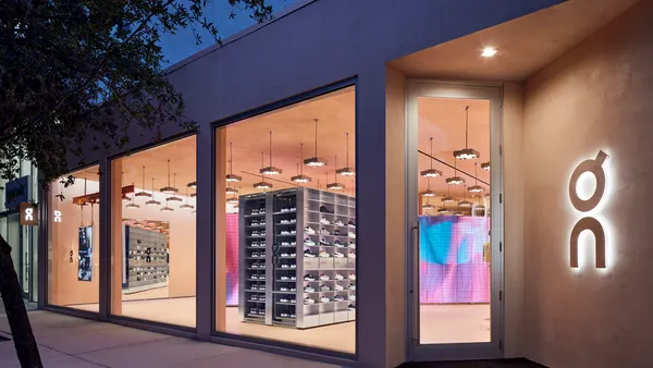 Warmly lit exterior image of On's Miami store