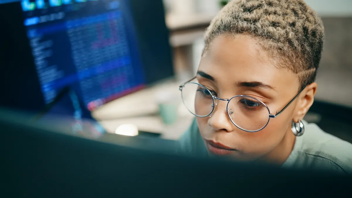 Computer, cyber security and face of woman programming ERP software, cybersecurity system or algorithm code. Programmer, developer or coding machine learning cloud computing server or IT database