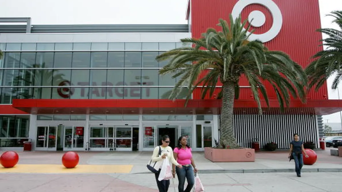 Customers carry bags as they leave a Target store in Albany, California