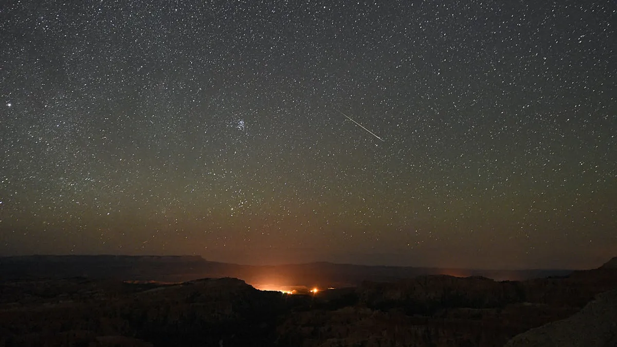 A Perseid meteor is seen in the night sky above Bryce Canyon National Park in Utah.