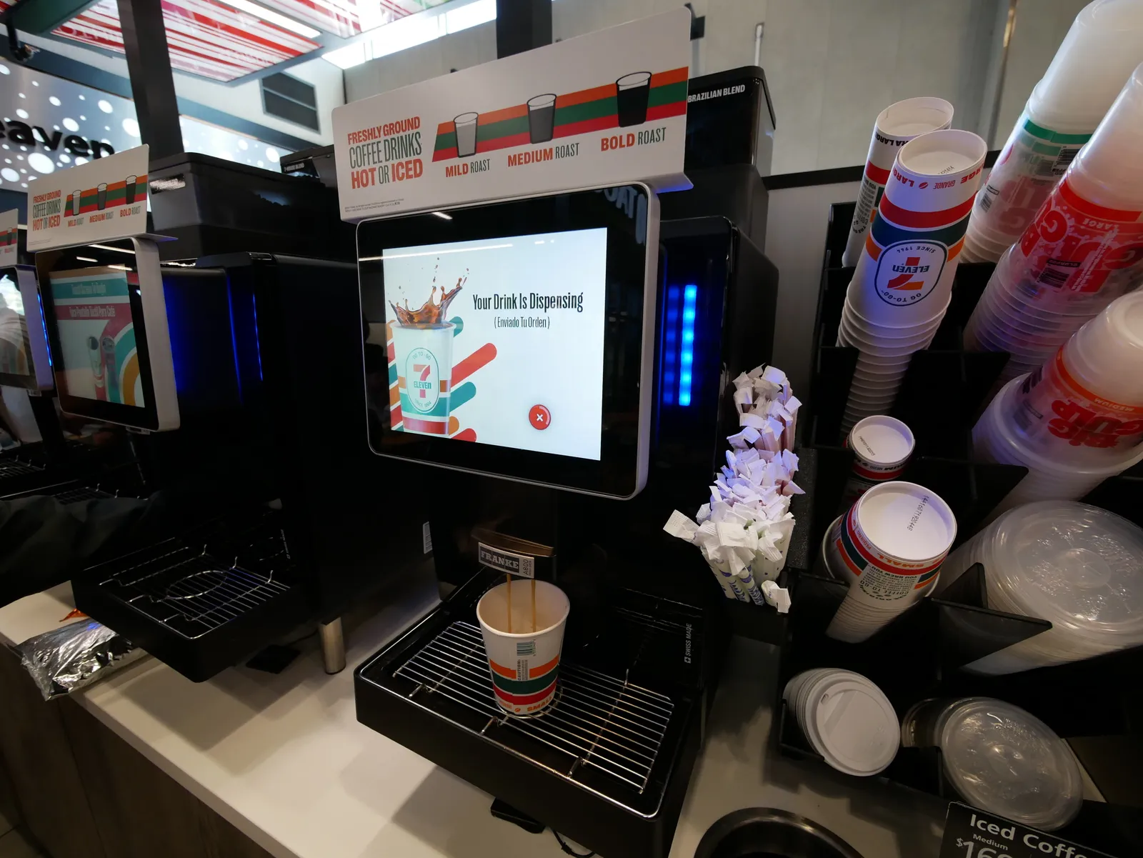 A photo of a coffee machine inside a 7-Eleven.