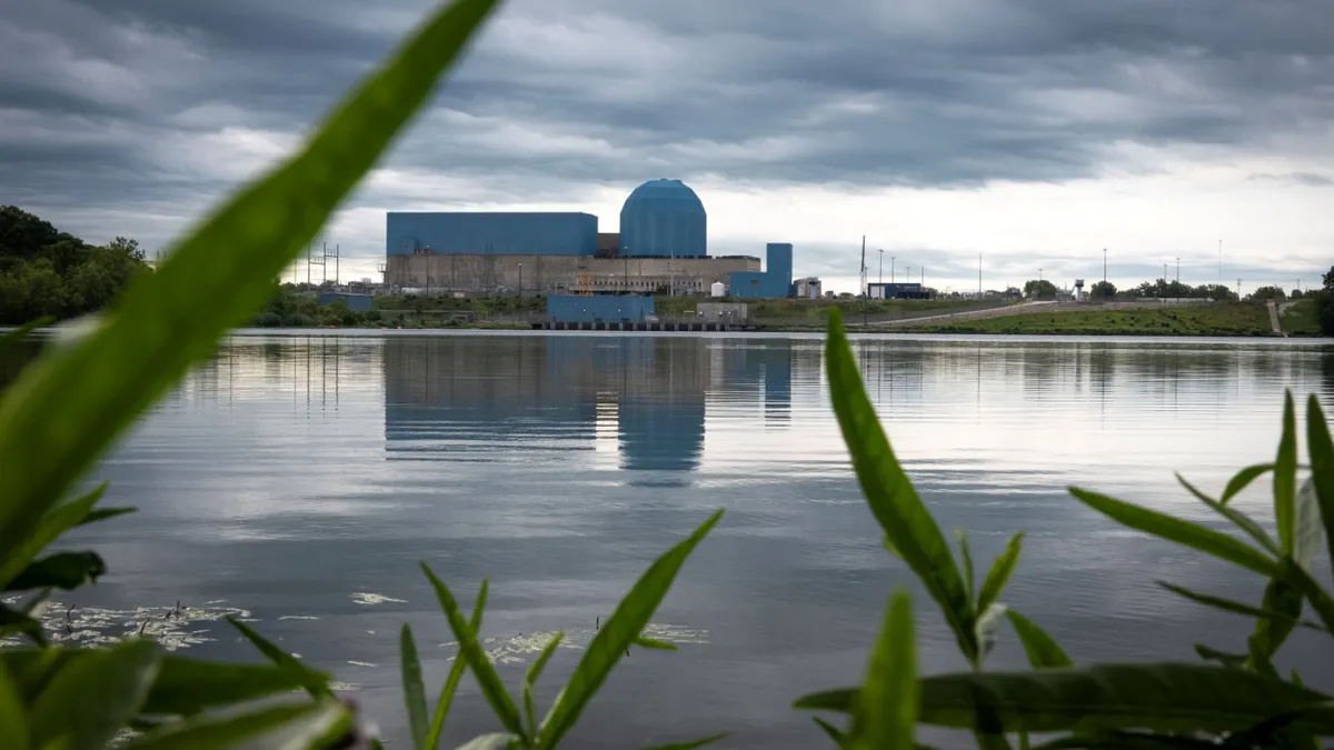 Storm clouds moving over a nuclear reactor power plant