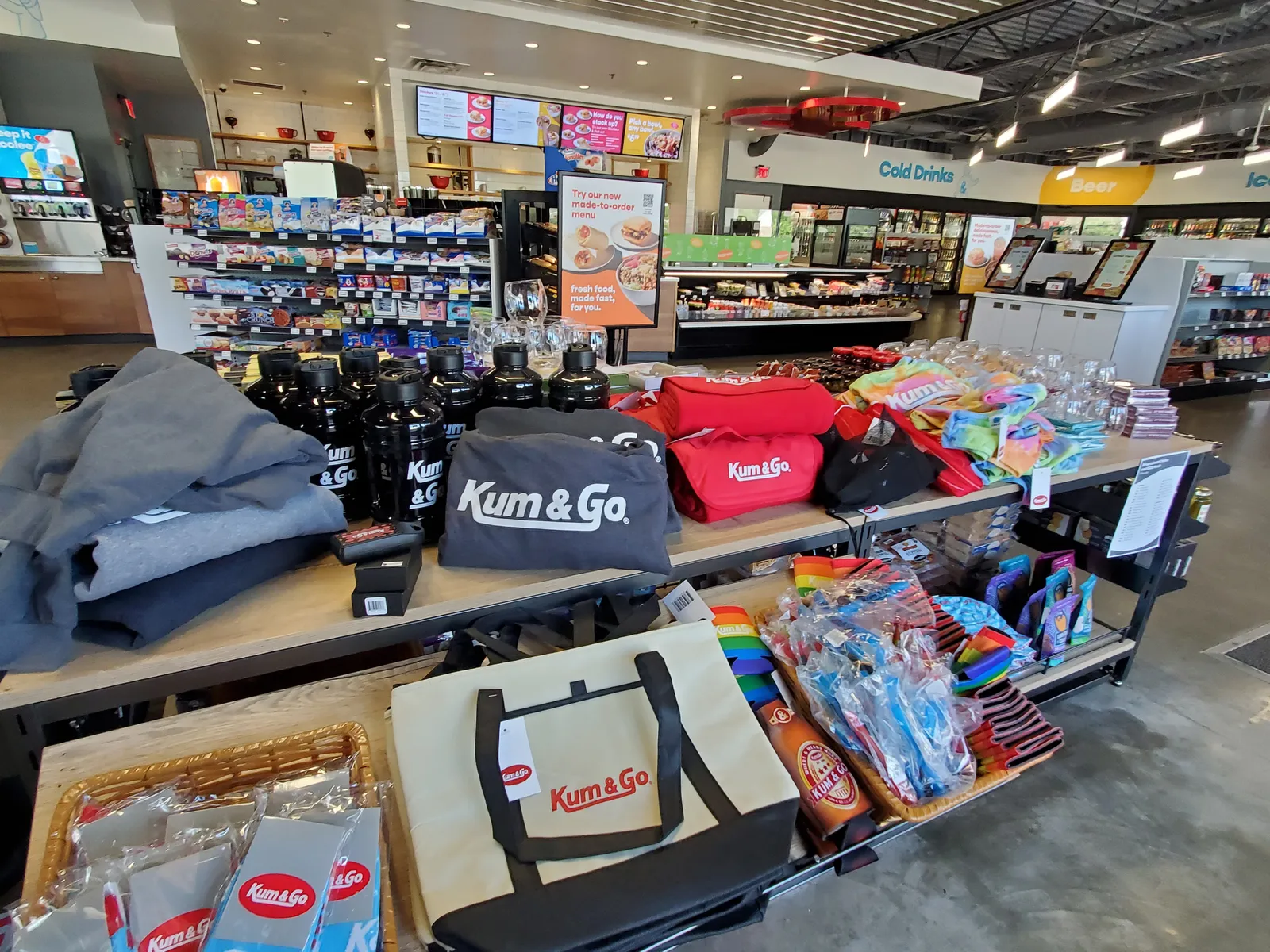 A photo of a display of Kum &amp; Go merchandise.