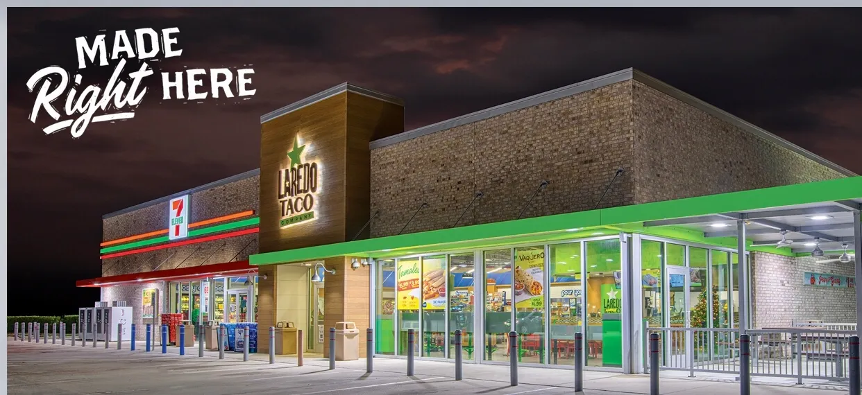 A photo fo the exterior of a building. Signs on the building say &quot;7-Eleven&quot; and &quot;Laredo Taco.&quot;