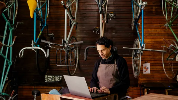 A man in a bicycle repair shop