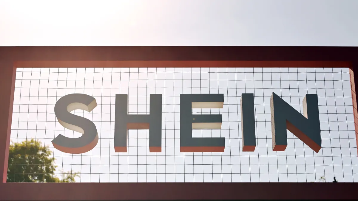 The Shein logo is pictured on a sign outdoors.