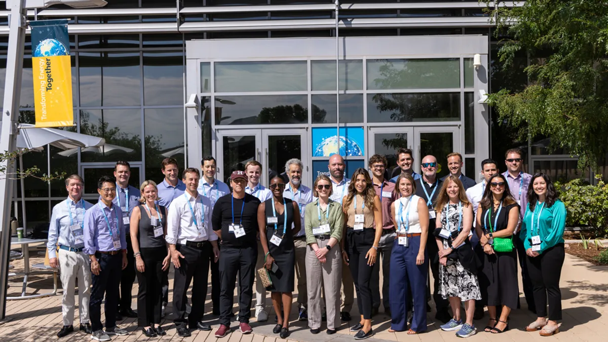 A full-length photo of representatives of the 10 organizations chosen to participate in the inaugural cohort of the new Scalable Tech Track program for cleantech adoption.