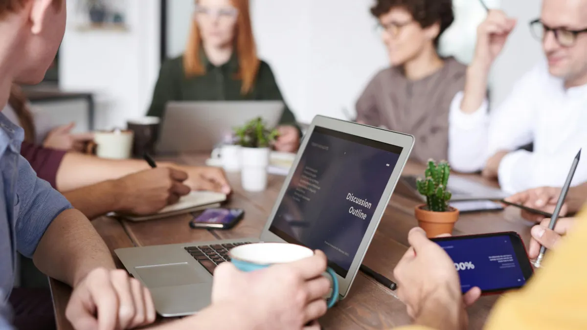 Young professionals collaborating on a presentation in an office setting.