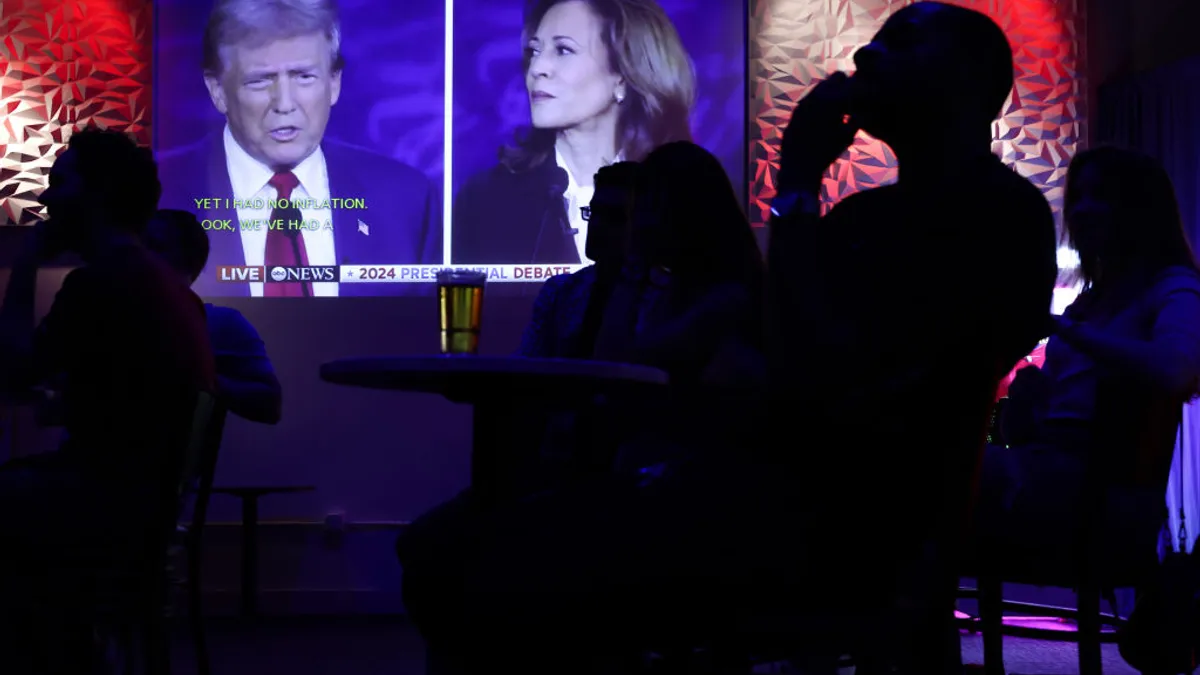 People watch the presidential debate during a debate watch party at Penn Social on Sept. 10, 2024, in Washington