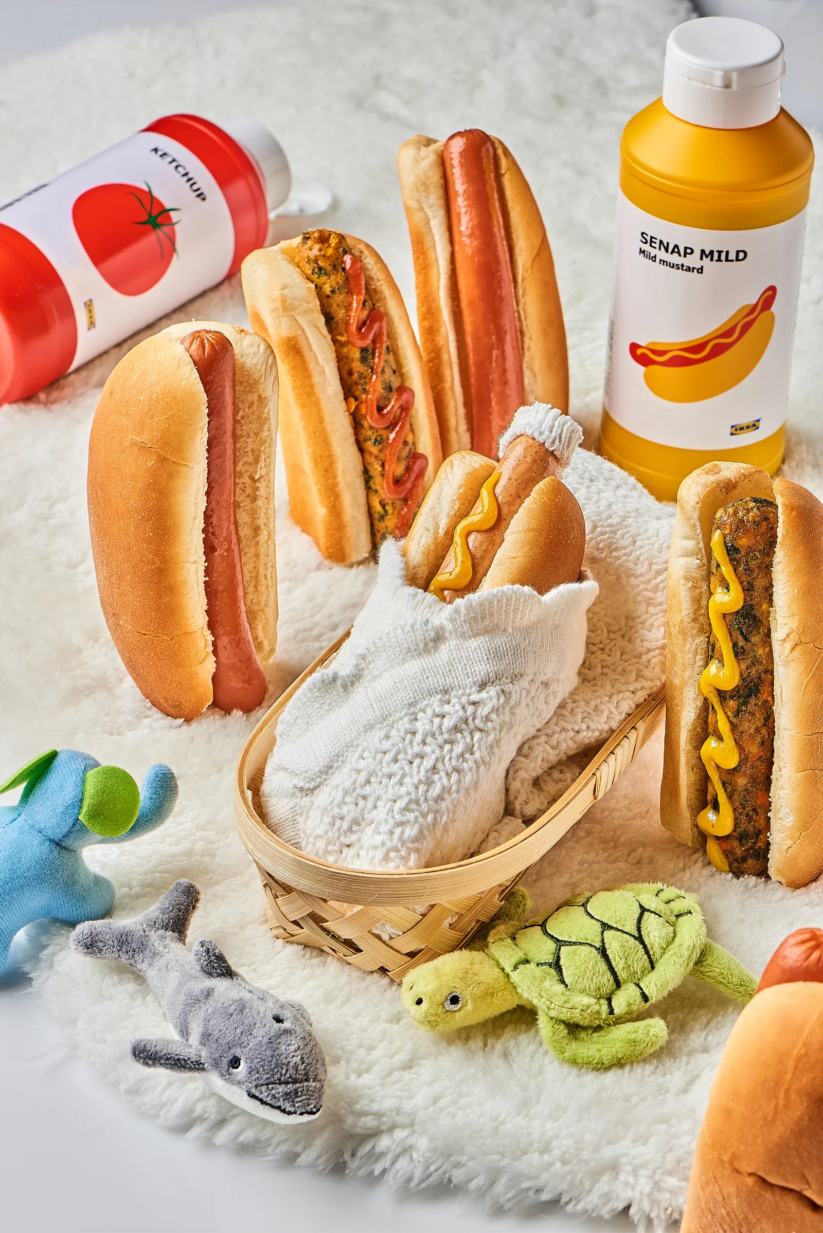 A brand image of Ikea&#x27;s plant-based hotdog dressed and decorated for a baby shower.