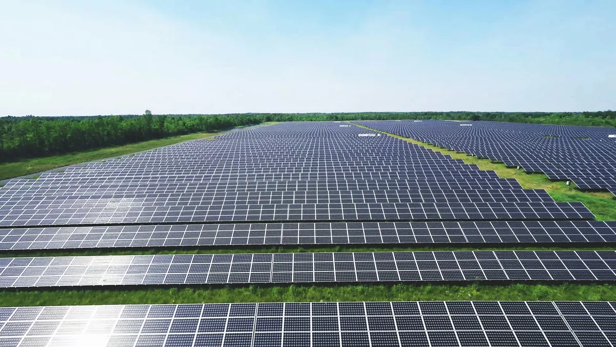 Solar panels on solar farm during a sunny day.