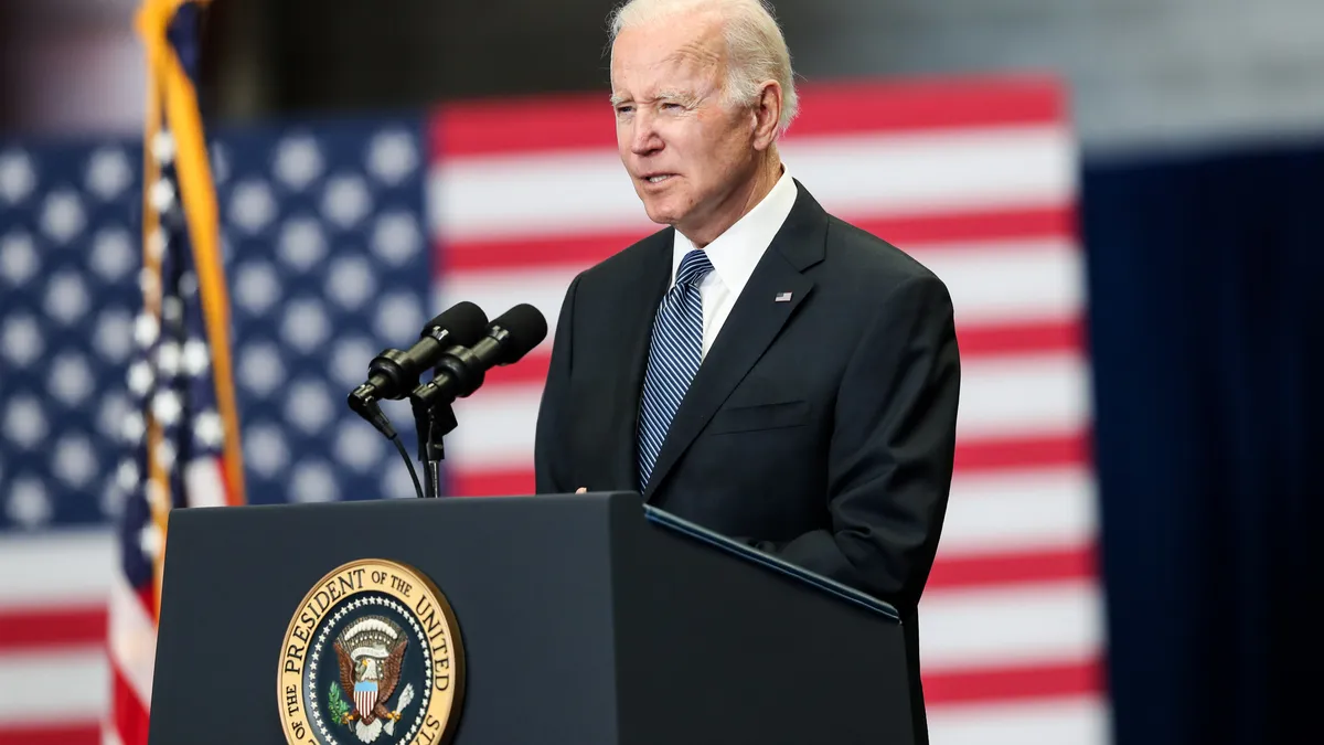 President Joe Biden speaking at a podium