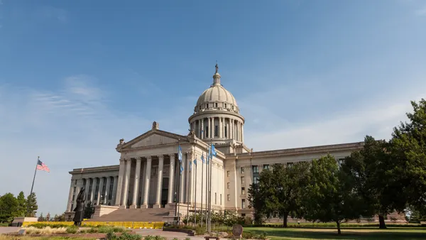 The Oklahoma state capitol is pictured against a blue sky